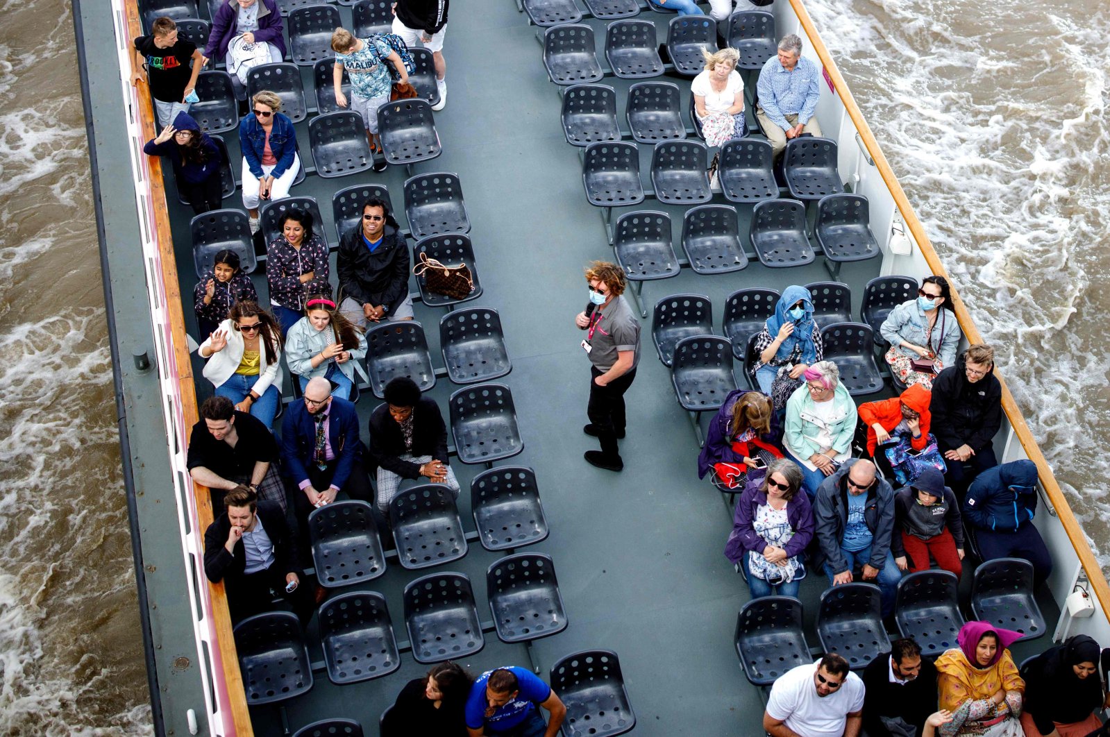 People enjoy a cruise tour on River Thames in central London, U.K., Aug. 24, 2020. (AFP Photo)