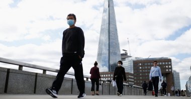 People walk over the London Bridge amid the coronavirus outbreak, London, Britain, Aug. 26, 2020. (Reuters Photo)