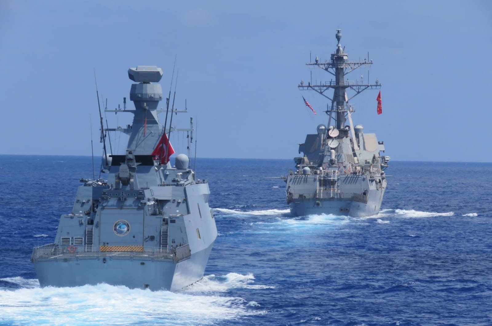 US destroyer USS Winston S. Churchill, rear, along with Turkish frigate TCG Barbaros conduct maritime trainings in the Eastern Mediterranean, Aug. 26, 2020. (AP Photo)