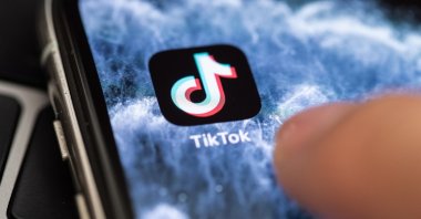 The logo of video app TikTok is seen on the screen of a smartphone in Berlin, July 7, 2020. (EPA Photo)