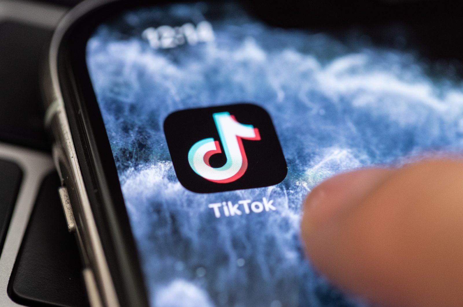 The logo of video app TikTok is seen on the screen of a smartphone in Berlin, July 7, 2020. (EPA Photo)