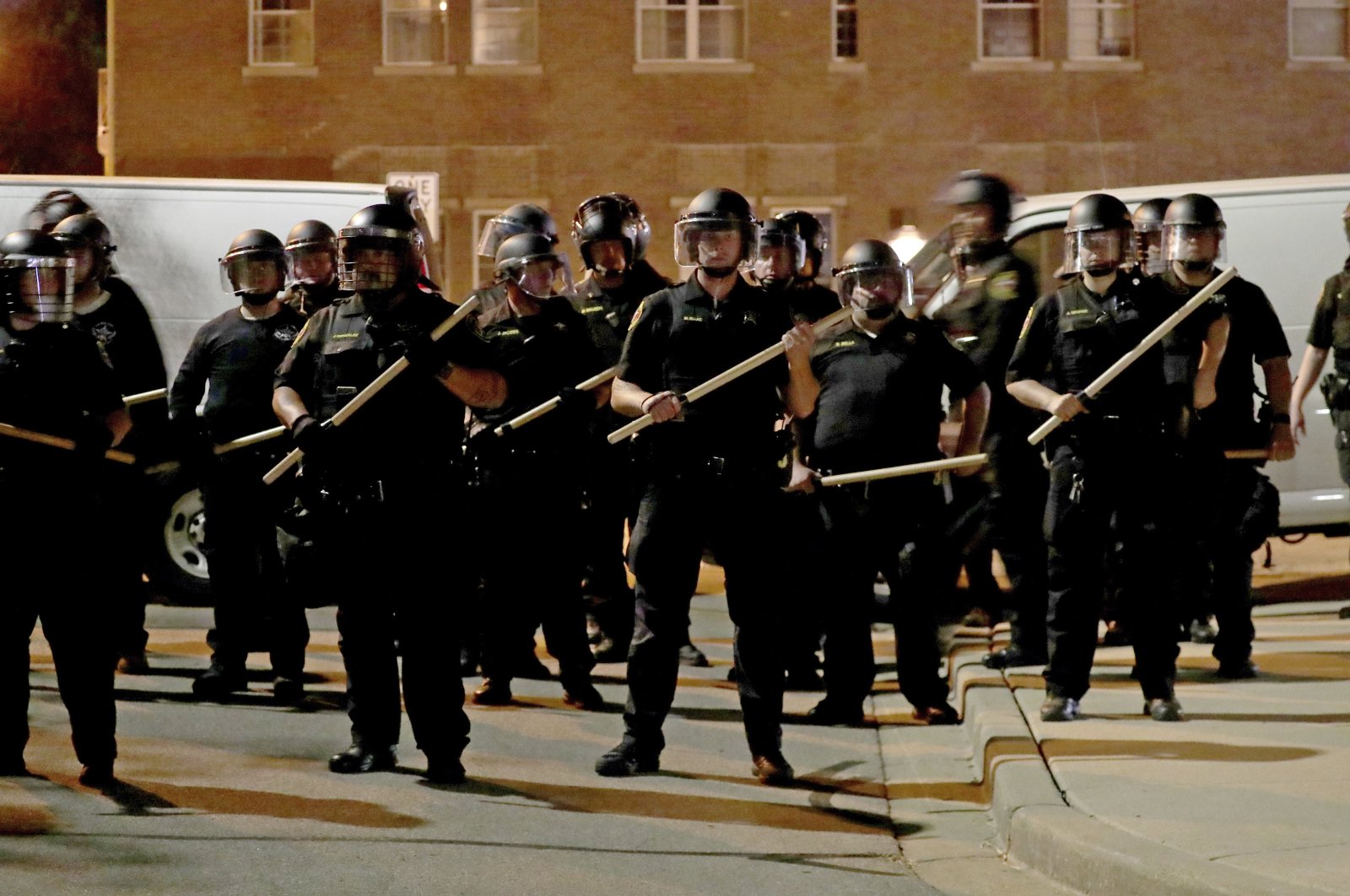 Police in riot gear stand guard in Kenosha, Wisconsin, U.S., Aug. 23, 2020. (Milwaukee Journal-Sentinel via AP)