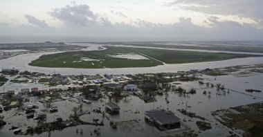 Storm surge is seen receding in Cameron, La. after the storm surge receded in the aftermath of Hurricane Laura, Friday, Aug. 28. (AP Photo)