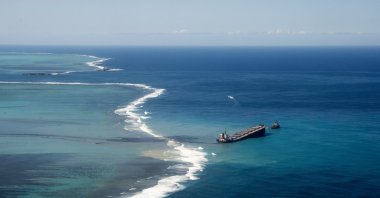 This photo provided by the French Army shows oil leaking from the MV Wakashio, a bulk carrier ship that ran aground off the southeast coast of Mauritius, Aug.11, 2020. (AP Photo)
