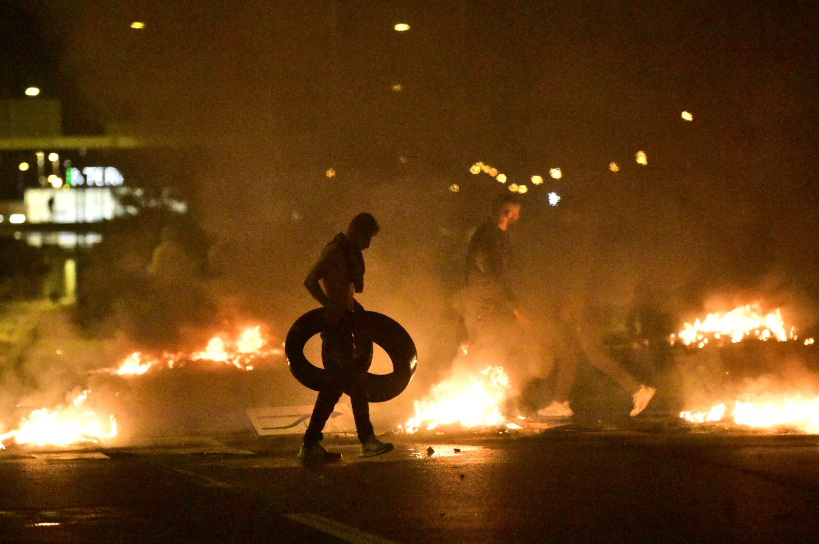 Demonstrators burn tires as protesters riot in the Rosengard neighborhood of Malmo, Sweden, Aug. 28, 2020. (EPA Photo)