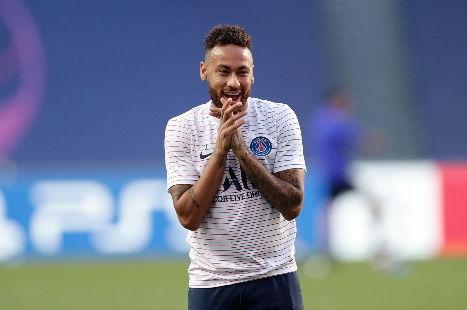 Neymar smiles as he takes part in a warmup prior to a match, Lisbon, Portugal, Aug. 18, 2020. (AFP Photo) 