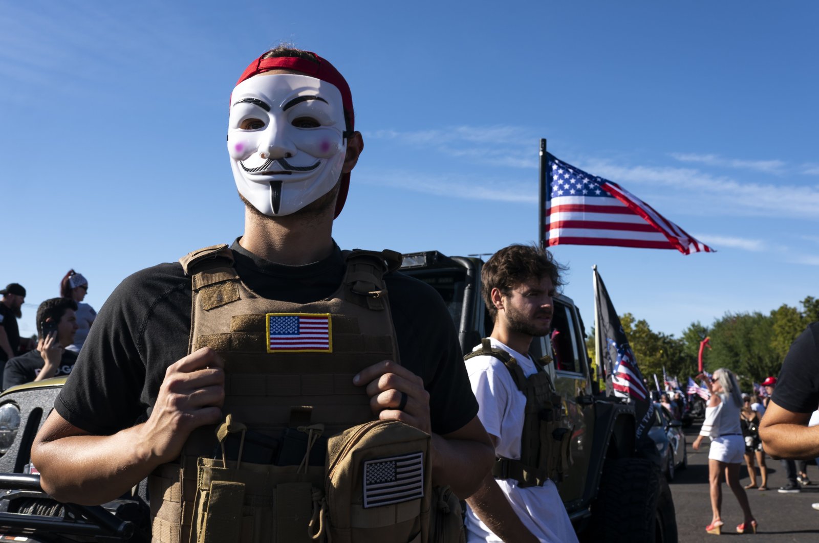 A man wears a Guy Fawkes mask during a rally in support of U.S. President Donald Trump, Clackamas, Oregon, Aug. 29, 2020. (AFP Photo)