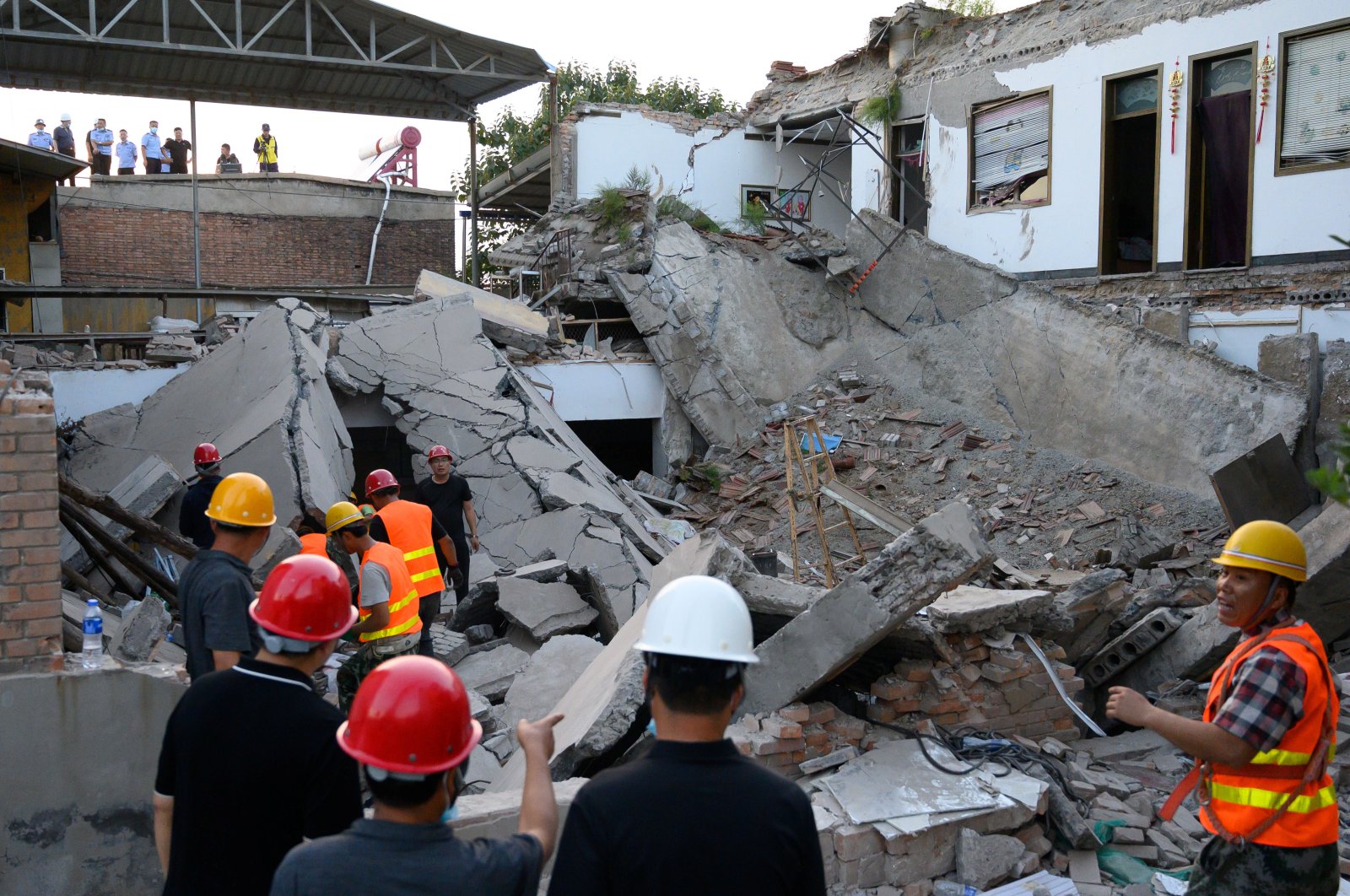 Rescue workers are seen at the site where a restaurant collapsed, in Xiangfen, Shanxi province, China Aug. 29, 2020. (CNS photo via Reuters)