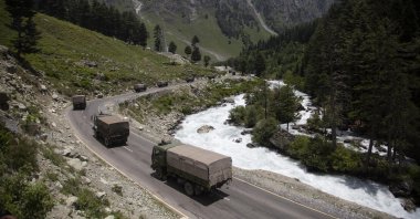 In this June 17, 2020, file photo, an Indian army convoy moves on the Srinagar-Ladakh highway at Gagangeer, north-east of Srinagar, India, two days after 20 Indian soldiers died in a brawl with Chinese soldiers in the Ladakh region. (AP Photo)