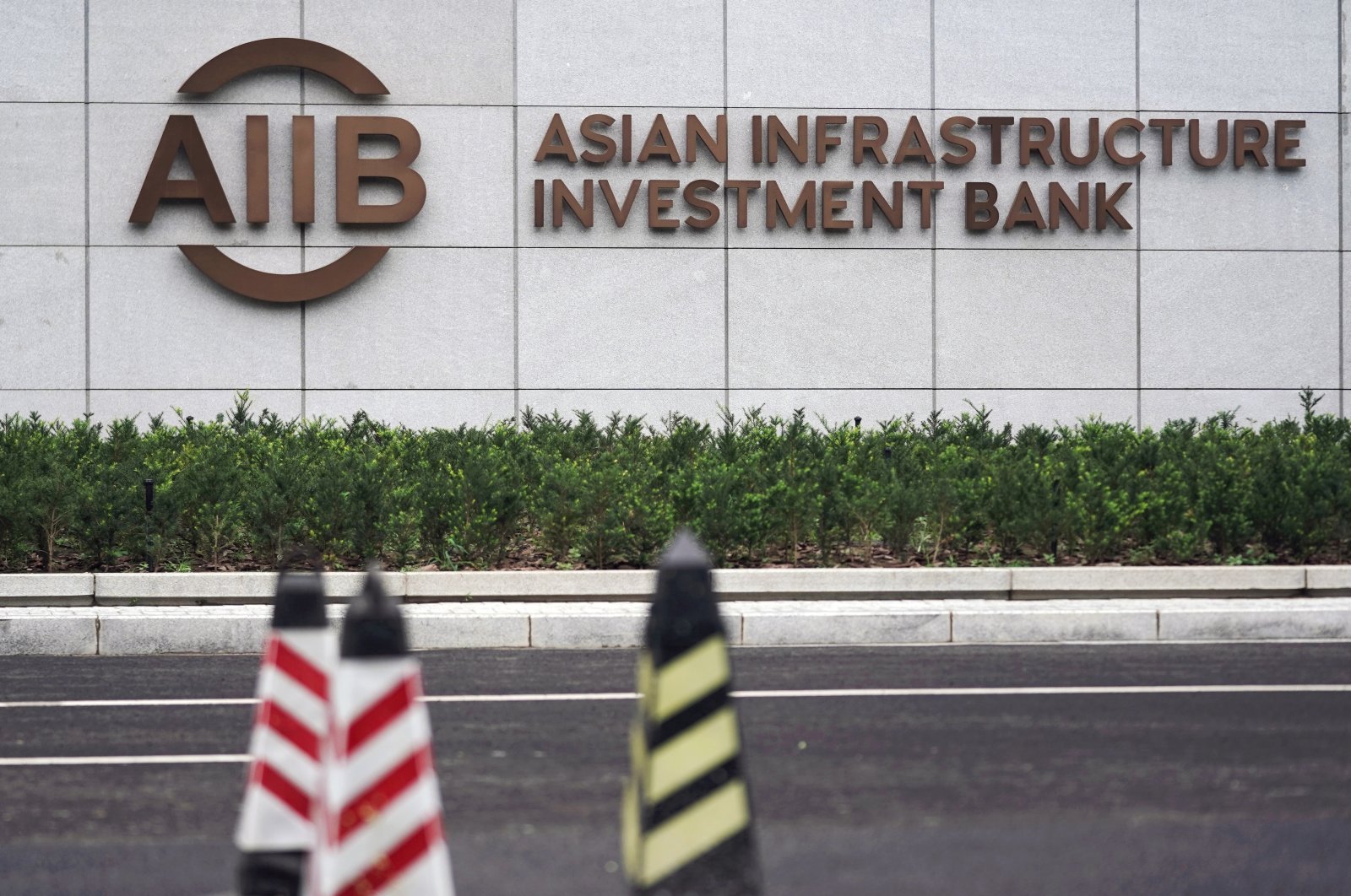 The sign of the Asian Infrastructure Investment Bank (AIIB) is pictured at its headquarters in Beijing, China, July 27, 2020. (Reuters Photo)