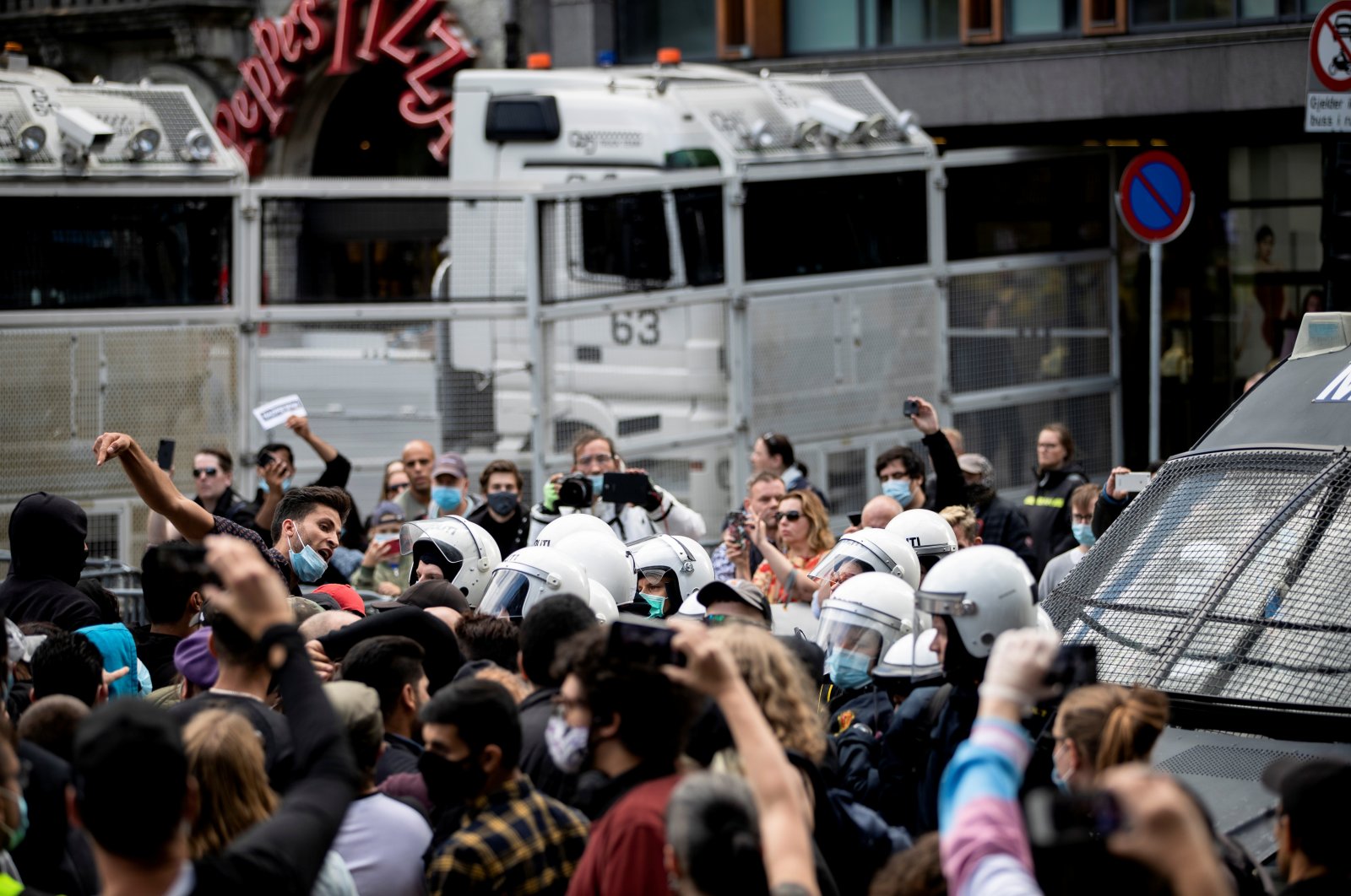 Police separate Stop the Islamization of Norway (SIAN) supporters and counter-protesters as the organization holds a rally in Oslo's city center, Norway on Aug. 29, 2020. (Reuters Photo)