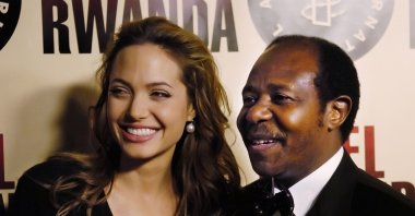 Paul Rusesabagina, the inspiration for the film "Hotel Rwanda," poses with actress Angelina Jolie at the premiere of the film at the Academy of Motion Picture Arts & Sciences in Beverly Hills, California on Dec. 2, 2004. (AP Photo)
