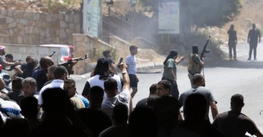 Gunmen open fire on a building in Khaldeh, south of Beirut, Lebanon, Aug. 28, 2020. (AP Photo)
