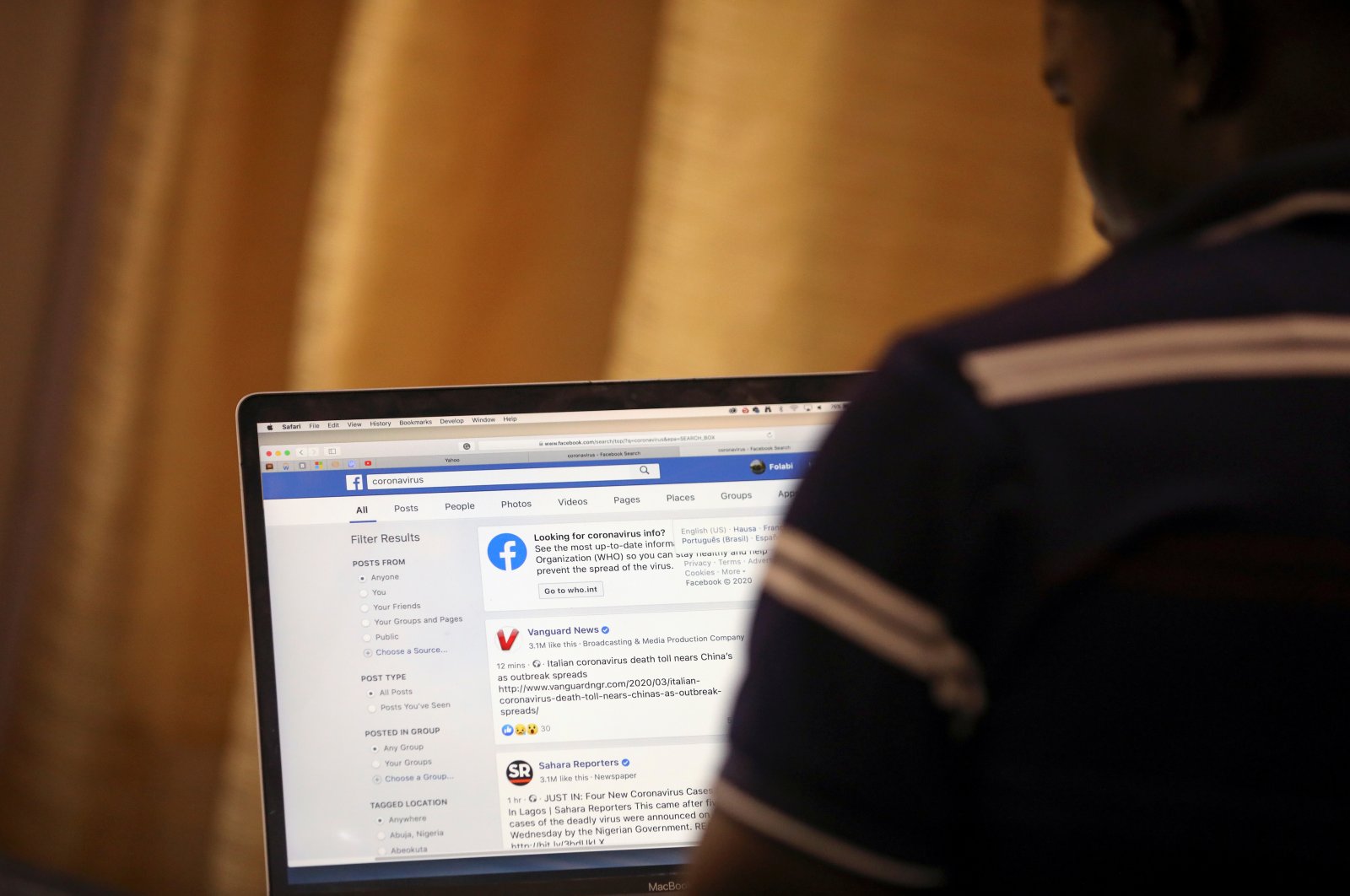A man opens a Facebook page on his computer to fact check coronavirus information, in Abuja, Nigeria, March 19, 2020. (Reuters Photo)