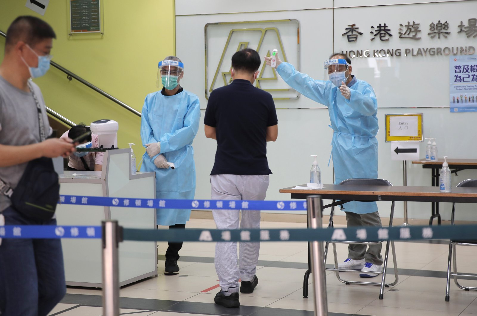 People receive temperature checks at a coronavirus testing center in Hong Kong, Sept. 1, 2020. (AP Photo)