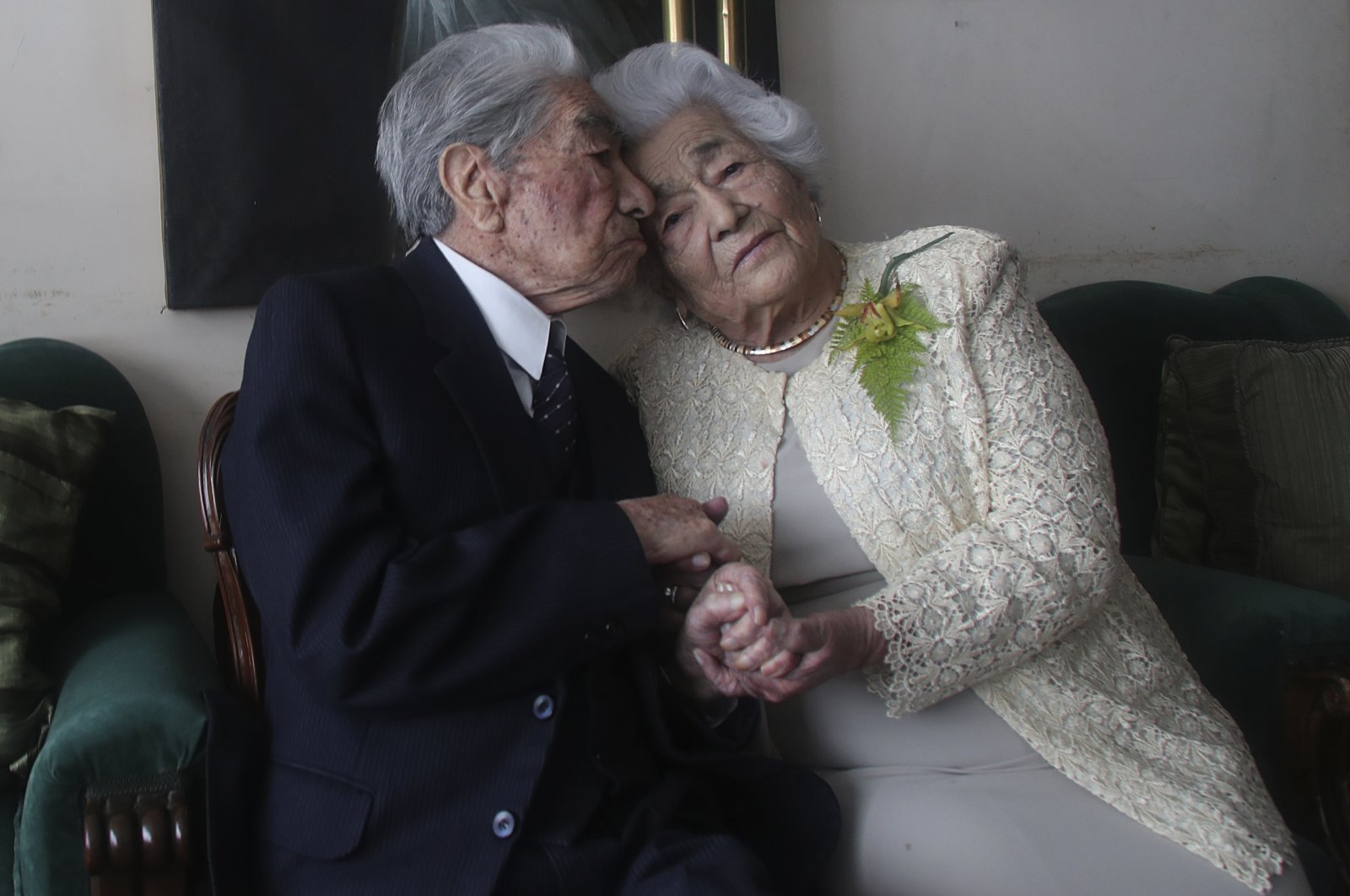 Married couple Julio Mora Tapia, 110, and Waldramina Quinteros, 104, both retired teachers, pose for a photo at their home in Quito, Ecuador, Aug. 28, 2020. (AP Photo)
