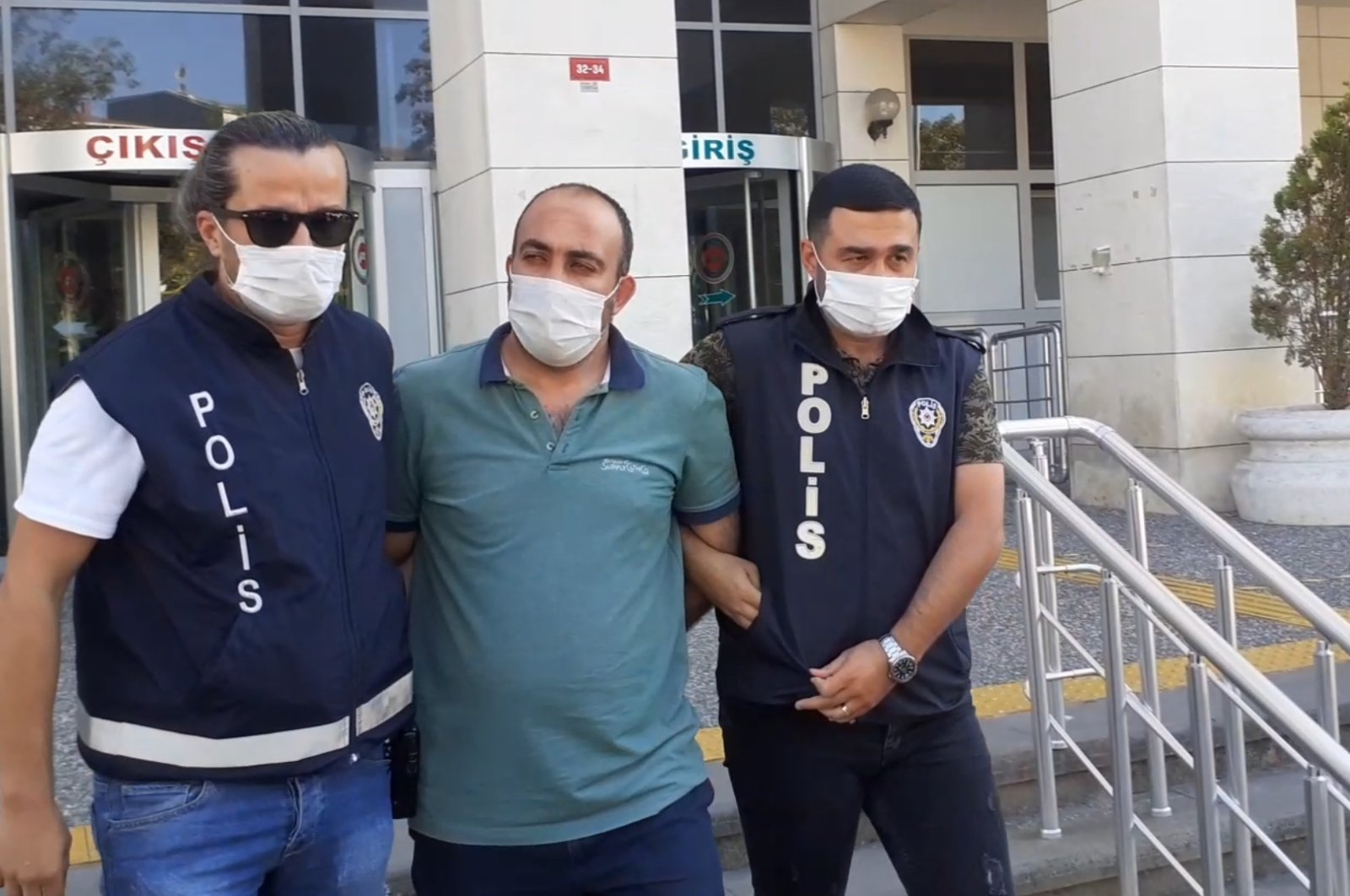 Police escort a captured FETÖ suspect, in Istanbul, Turkey, Aug. 28, 2020. (AA Photo) 