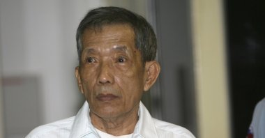 Former Khmer Rouge prison chief Kaing Guek Eav, also know as Duch, looks on during the first day of a U.N.-backed tribunal, Phnom Penh, March 20, 2020. (AP Photo)