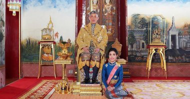 This undated file photo posted on Aug. 26, 2019, on the Thailand Royal Office website shows King Maha Vajiralongkorn with Major General Sineenatra Wongvajirabhakdi, the royal noble consort. (Thailand Royal Office Photo via AP)