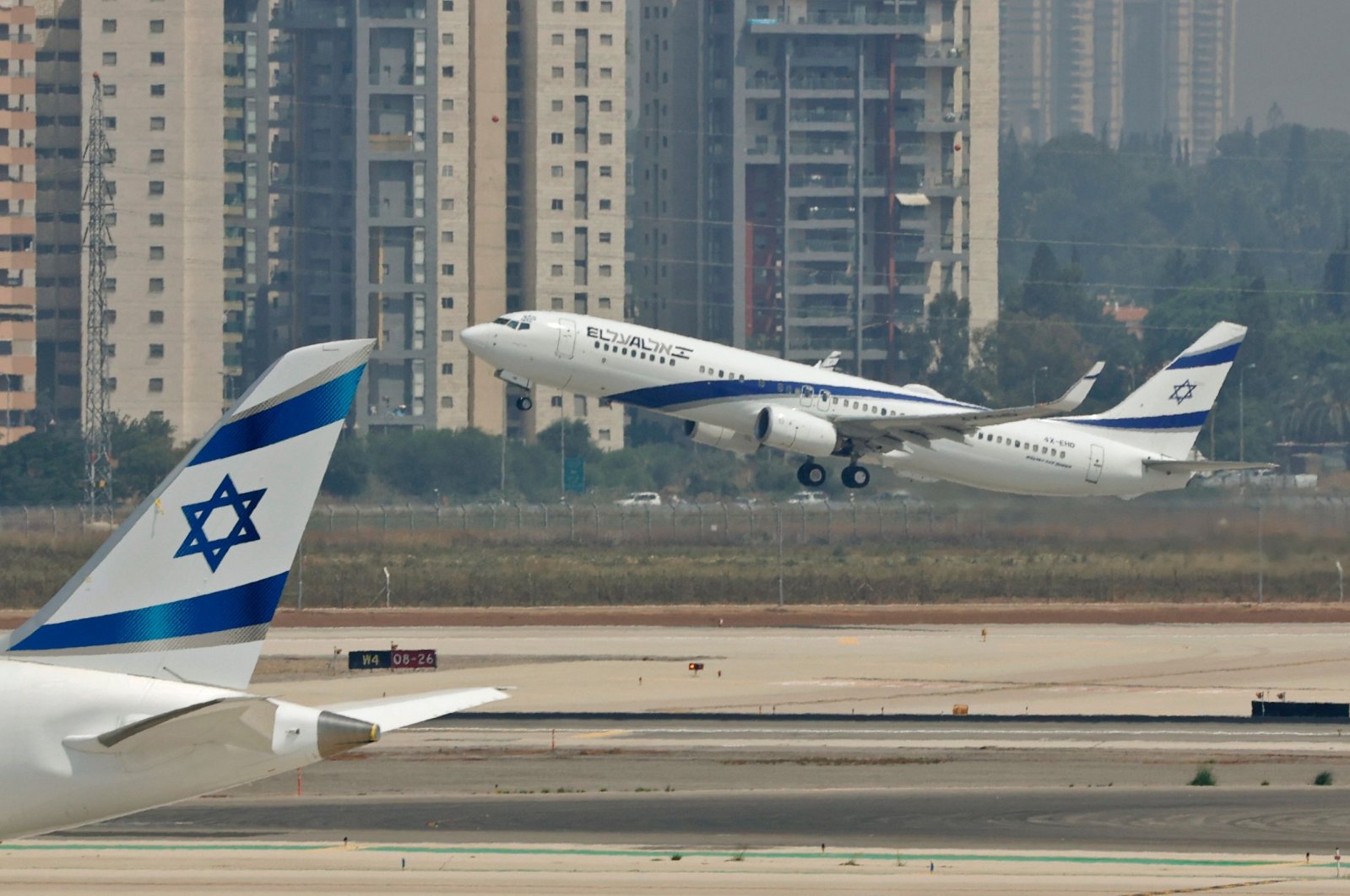 El Al's airliner, which is carrying a U.S.-Israeli delegation to the UAE following a normalization accord, takes off for the first-ever commercial flight from Israel to the UAE at the Ben Gurion Airport near Tel Aviv, Aug. 31, 2020. (AFP Photo)