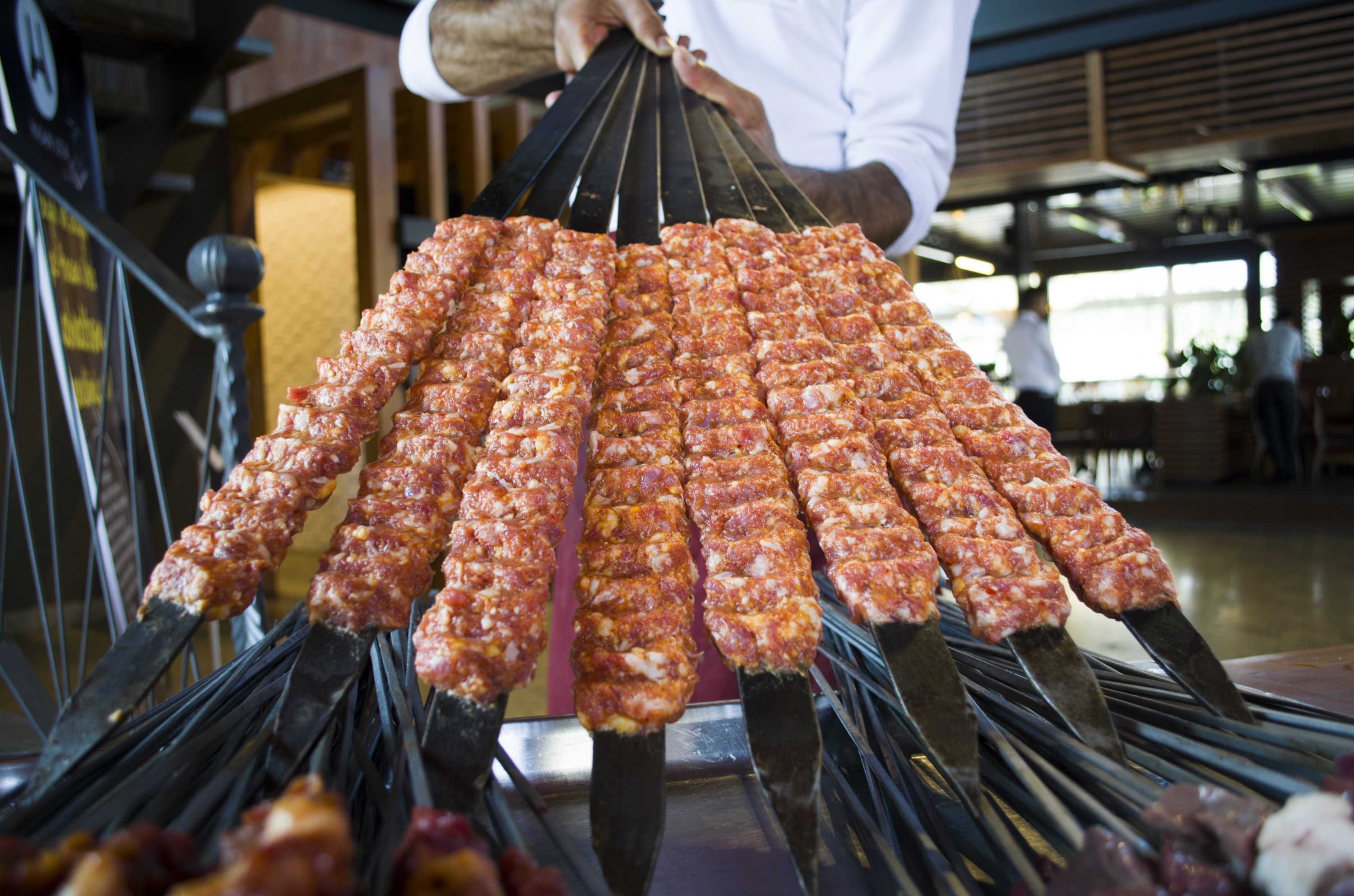 Urfa and Adana kebabs are cooked on flat iron skewers. (Shutterstock Photo)