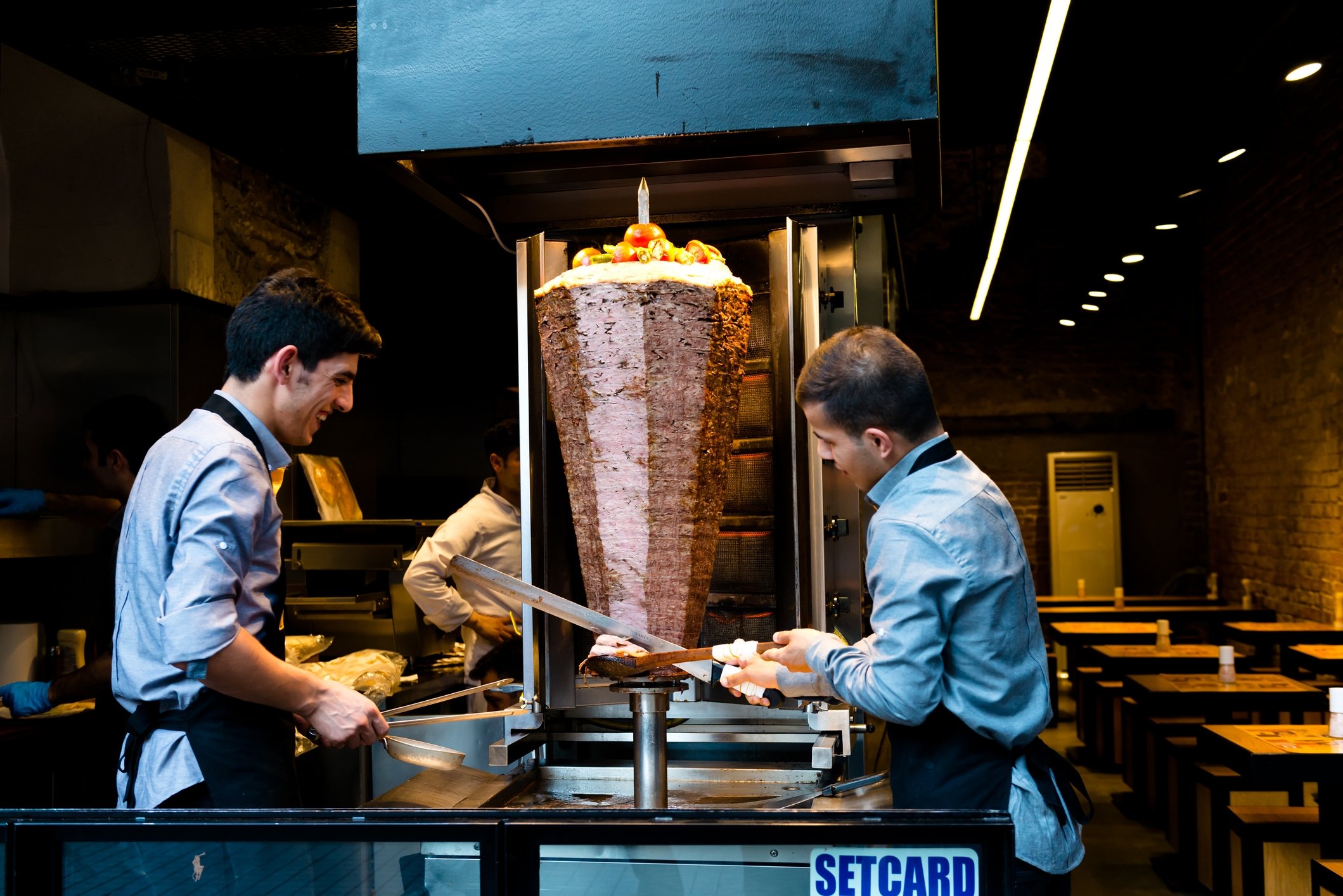 Two men are seen preparing döner kebab at a restaurant on the streets of Istanbul, Turkey, June 4, 2015. (iStock Photo)