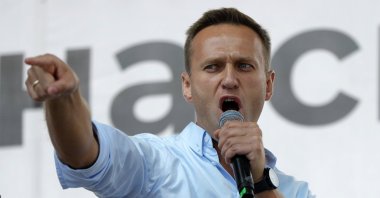 In this Saturday, July 20, 2019 file photo Russian opposition activist Alexei Navalny gestures while speaking to a crowd during a political protest in Moscow, Russia. (AP Photo)
