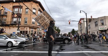 A crowd of protesters gather near the site where Daniel Prude was restrained by police officers, Rochester, N.Y., Sept. 2, 2020. (AP Photo)
