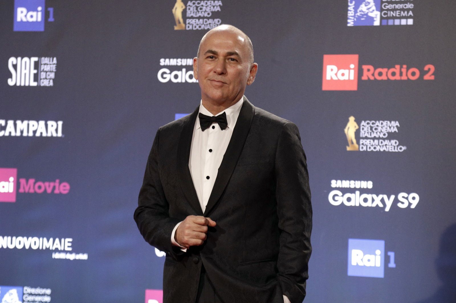 Turkish director Ferzan Özpetek walks the red carpet as he arrives to attend the David Donatello awards ceremony in Rome, March 21, 2018. (AP Photo)