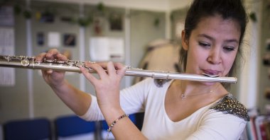 Merve Başoğlu plays flute in the capital Ankara, Turkey, Nov. 28, 2016. (AA Photo) 