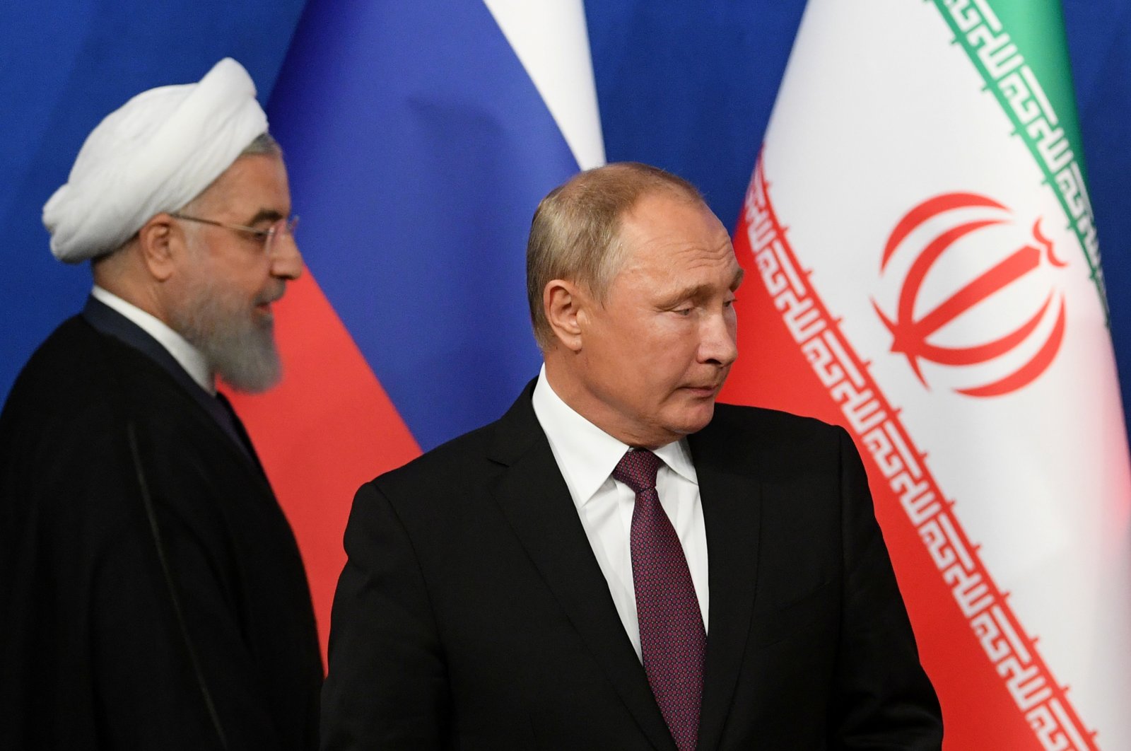 Iranian President Hassan Rouhani (L) and his Russian counterpart President Vladimir Putin arrive for a news conference following their meeting in Tehran, Iran, Sep. 7, 2018. (Reuters Photo)