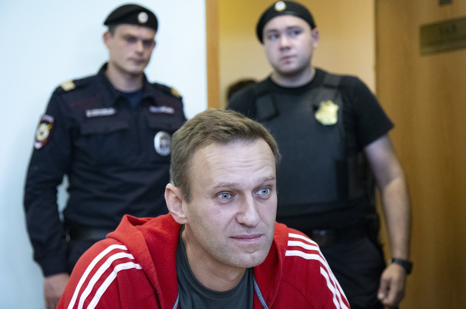 Russian opposition leader Alexei Navalny speaks to the media prior to a court session in Moscow, Russia, Aug. 22, 2019. (AP Photo)