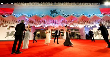 People gather for red carpet arrivals for the screening of the film "The Duke" at the 77th Venice Film Festival in Venice, Italy on Sept. 4, 2020. (Reuters Photo)