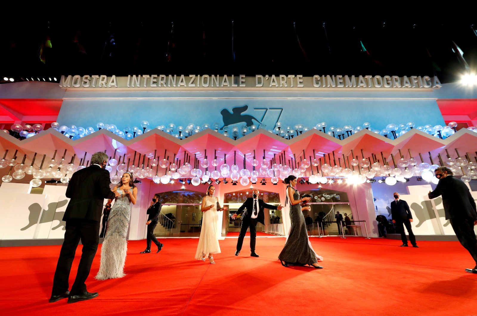 People gather for red carpet arrivals for the screening of the film "The Duke" at the 77th Venice Film Festival in Venice, Italy on Sept. 4, 2020. (Reuters Photo)