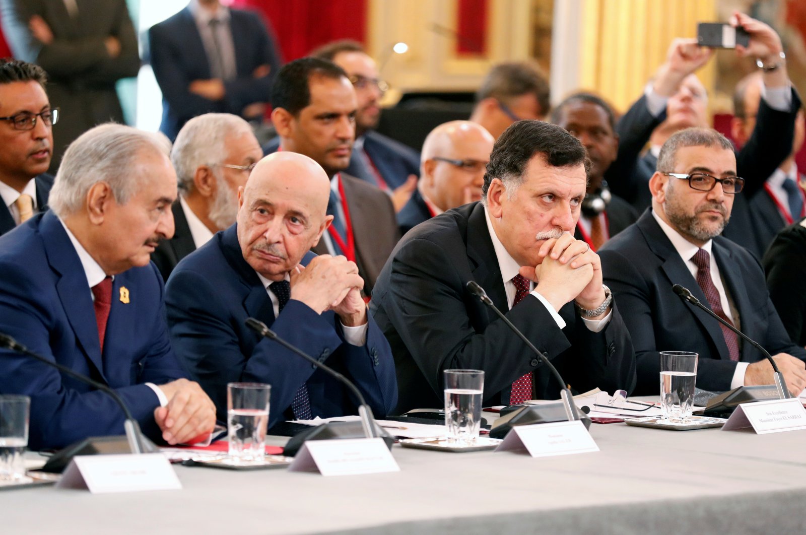 From left to right, putschist Gen. Khalifa Haftar, Aguila Saleh Issa, president of the eastern Libyan House of Representatives, Libyan Prime Minister Fayez Sarraj and Khaled al-Mishri, president of Libya High Council of State, during an international conference on Libya at the Elysee Palace in Paris, France, May 29, 2018. (Reuters Photo)