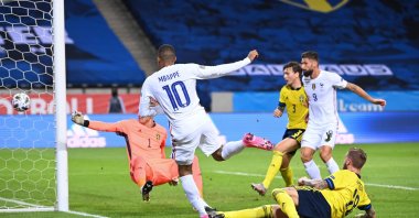 France's Kylian Mbappe scores the opening goal during the UEFA Nations League football match against Sweden in Stockholm, Sweden, Sept. 5, 2020. (AFP Photo)