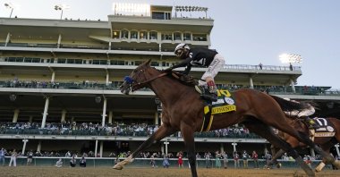 Jockey John Velazquez riding Authentic crosses the finish line to win the 146th running of the Kentucky Derby in Louisville, Kentucky, Sept. 5, 2020. (AP Photo)