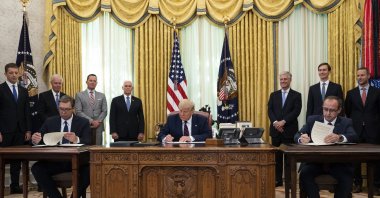 U.S. President Donald Trump participates in a signing ceremony with Serbian President Aleksandar Vucic, left, and Kosovar Prime Minister Avdullah Hoti, in the Oval Office of the White House, Friday, Sept. 4, 2020, in Washington. (AP Photo)