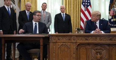 President Donald Trump listens to Serbian President Aleksandar Vucic speak during a signing ceremony with Kosovar Prime Minister Avdullah Hoti at the White House, Washington, Friday, Sept. 4, 2020. (AP Photo)