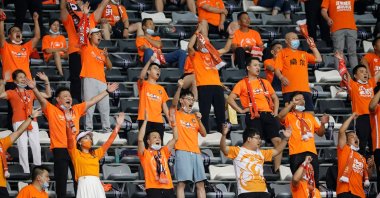 Supporters of Wuhan Zall cheer for the team during the Chinese Super League football match (CSL) between Wuhan Zall and Beijing Guoan in Suzhou in China's eastern Jiangsu province on September 6, 2020. (AFP Photo)