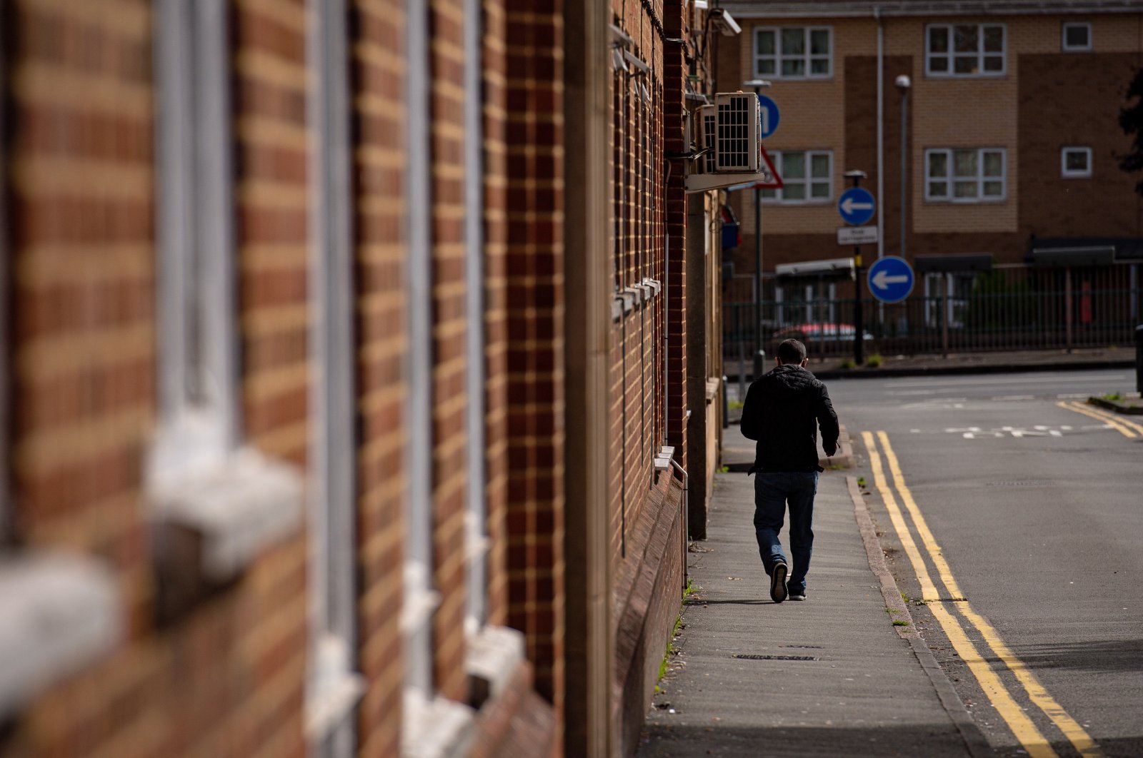 A man walks past The Stone Road hostel in Edgbaston, which has been closed following an outbreak of the coronavirus, Birmingham, Sept. 5, 2020. (Reuters Photo)