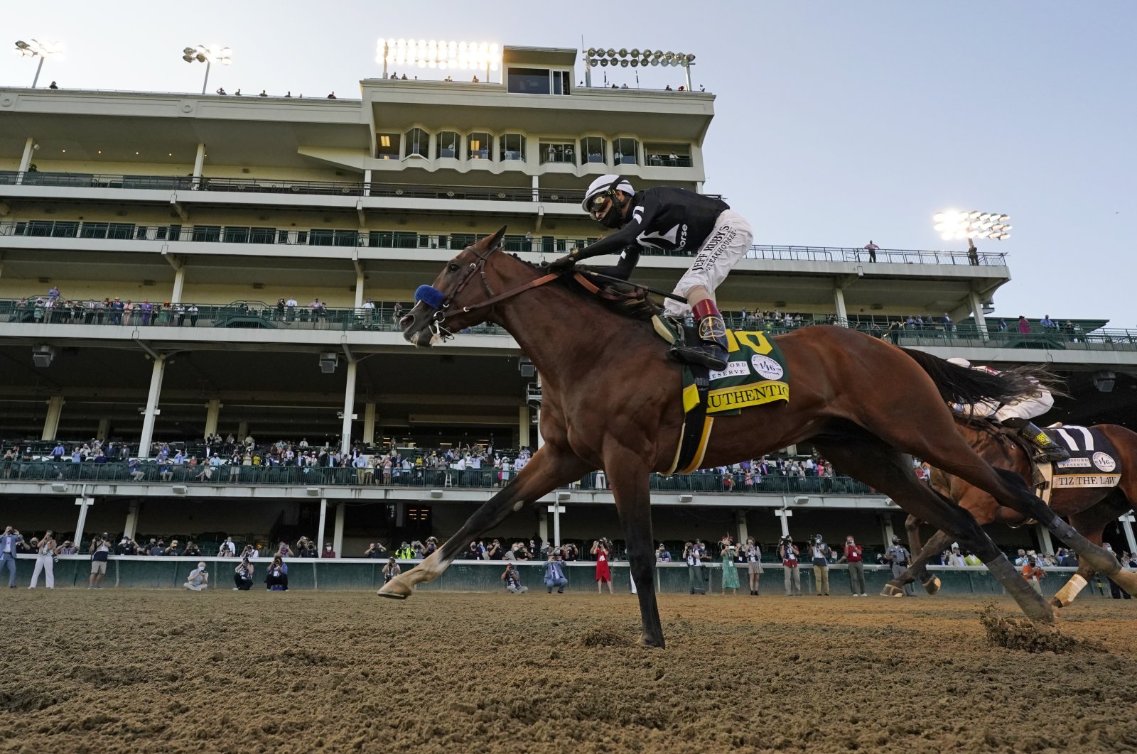 Jockey John Velazquez riding Authentic crosses the finish line to win the 146th running of the Kentucky Derby in Louisville, Kentucky, Sept. 5, 2020. (AP Photo)