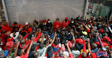 Economic Freedom Fighters (EFF) leader Julius Malema (C) addresses his supporters during a picket outside Clicks Store at the Mall of the North in Polokwane, Sept. 7, 2020. (AFP Photo)