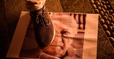 A man steps on a poster of FETÖ leader Fetullah Gülen during a rally to protest the group's coup attempt, in Istanbul, Turkey, July 18, 2016. (AFP Photo) 