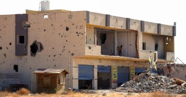 A picture shows a business, damaged during the 14 months of fighting between the U.N. recognized Government of National Union (GNA) and putschist Gen. Khalifa Haftar, in a southern neighborhood in the capital Tripoli on July 9, 2020. (AFP File Photo)