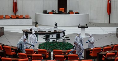 Workers disinfect the General Assembly at the Grand National Assembly of Turkey on Tuesday, March 17, 2020. (DHA Photo)