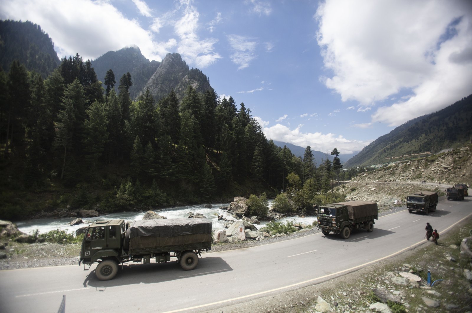 An Indian army convoy moves along the Srinagar-Ladakh highway at Gagangeer, northeast of Srinagar, Indian-controlled Kashmir, Sept. 1, 2020. (AP Photo)