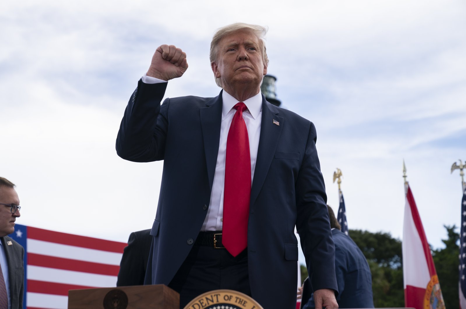 President Donald Trump pumps his fist after signing an executive order on protecting Florida coastline from offshore drilling after delivering remarks on the environment at Jupiter Inlet Lighthouse and Museum, Tuesday, Sept. 8, 2020. (AP Photo)