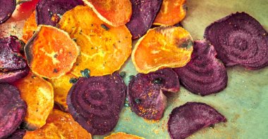 Though oven-baked vegetable chips may use less oil, the level of salt in packaged snacks is alarming. (iStock Photo)