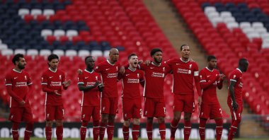 Liverpool players stand on the pitch during a match against Arsenal, in London, United Kingdom, Aug. 29, 2020. (AP Photo)